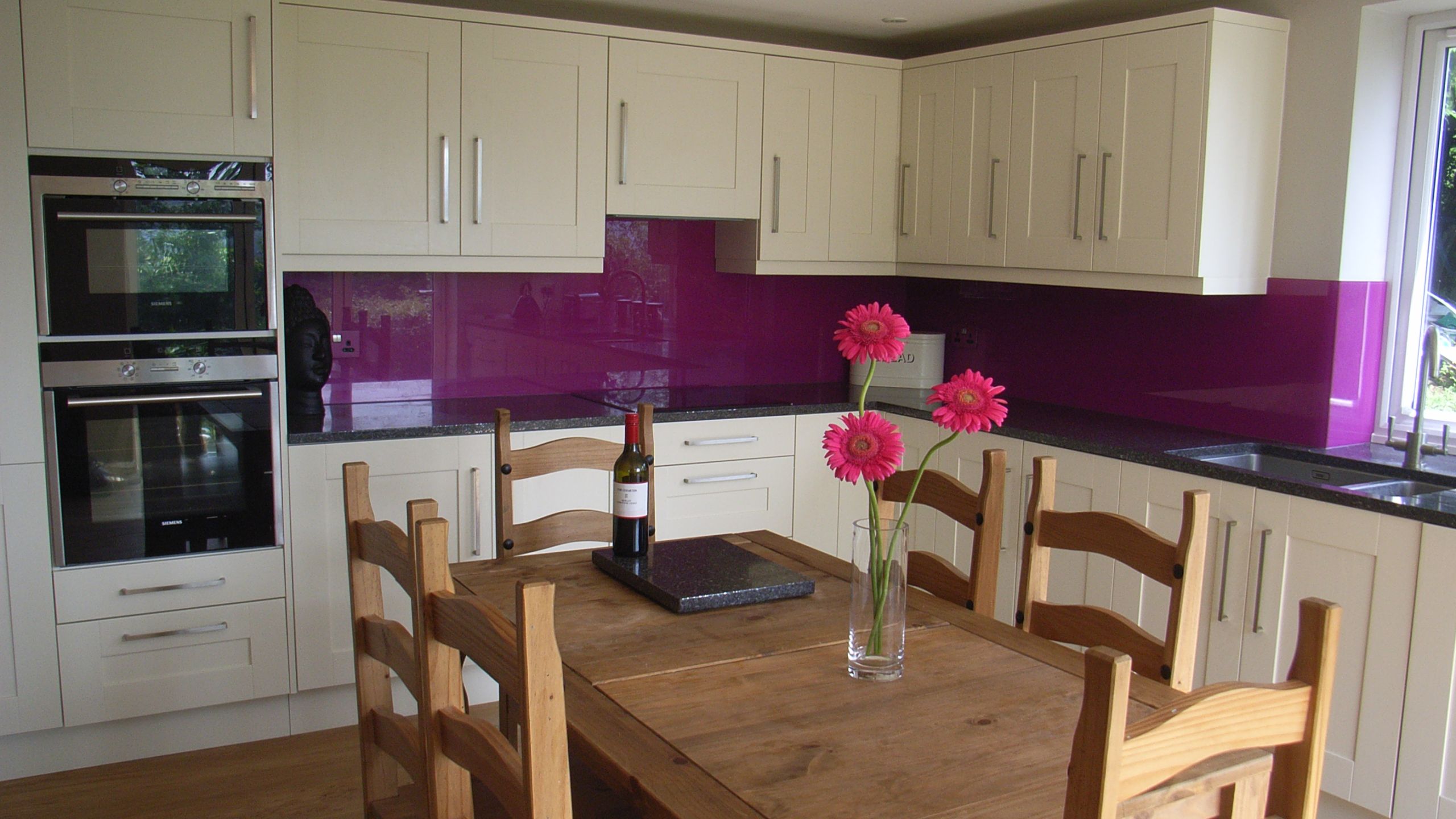 kitchen with purple splashback