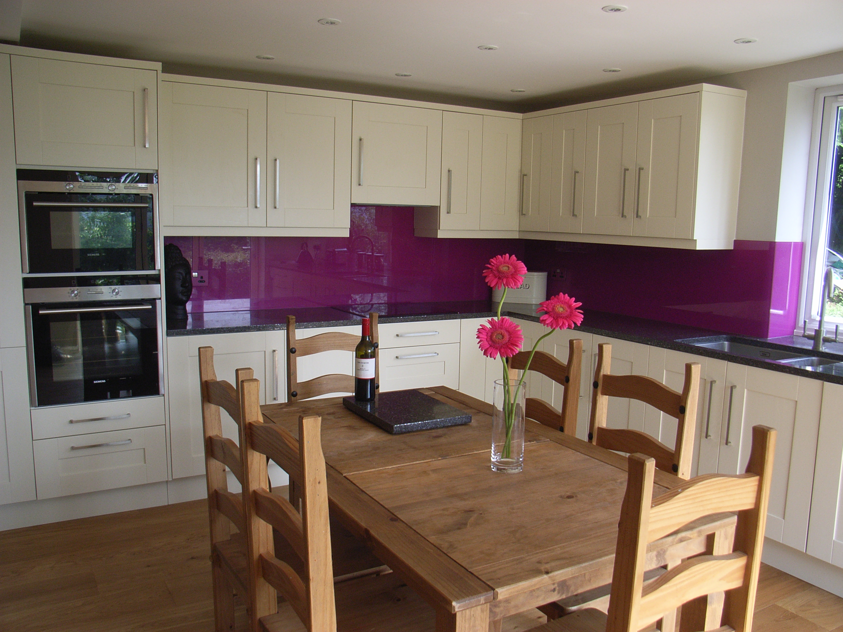 kitchen with purple splashback