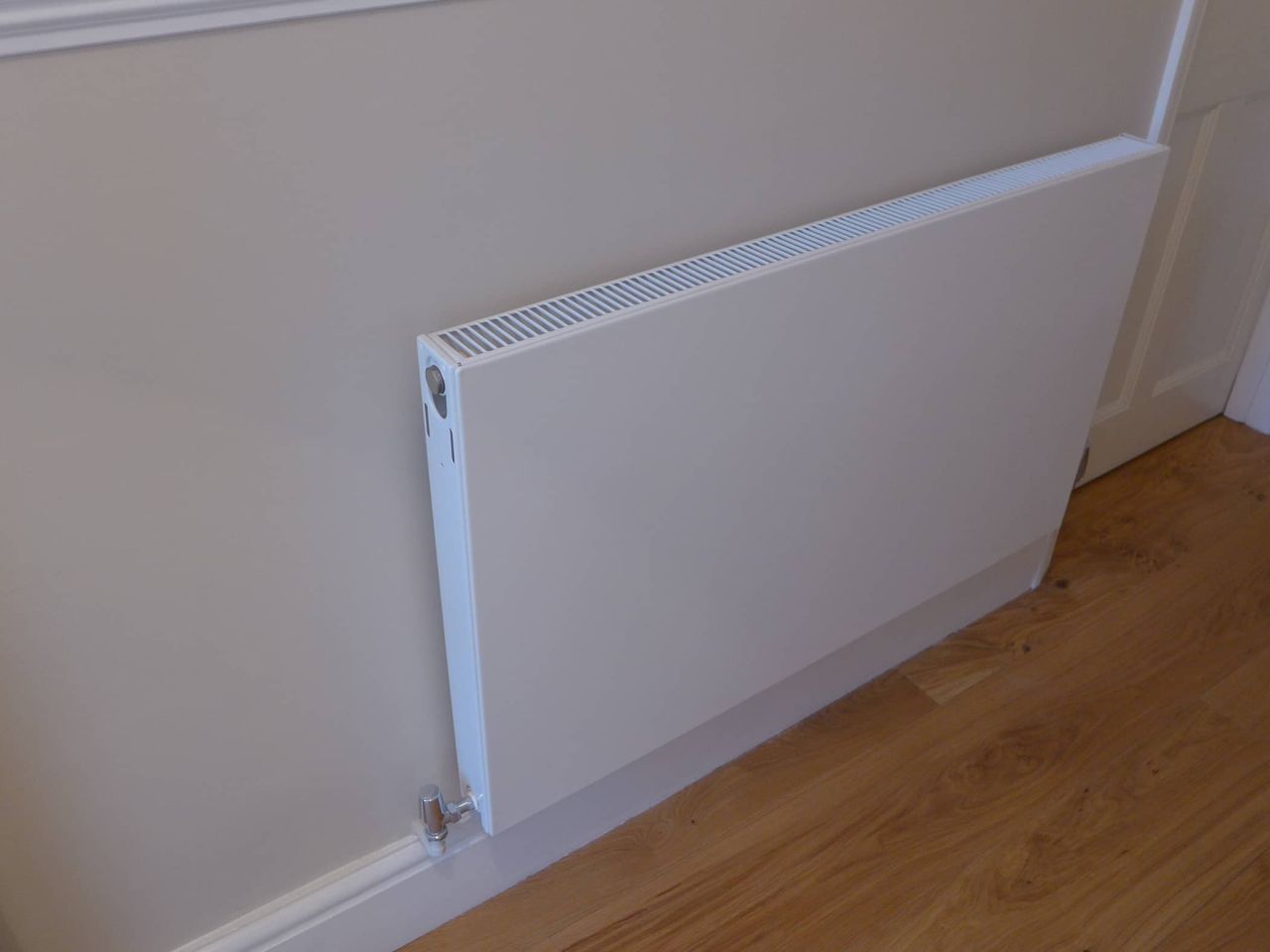 flat low profile radiator painted in with wall