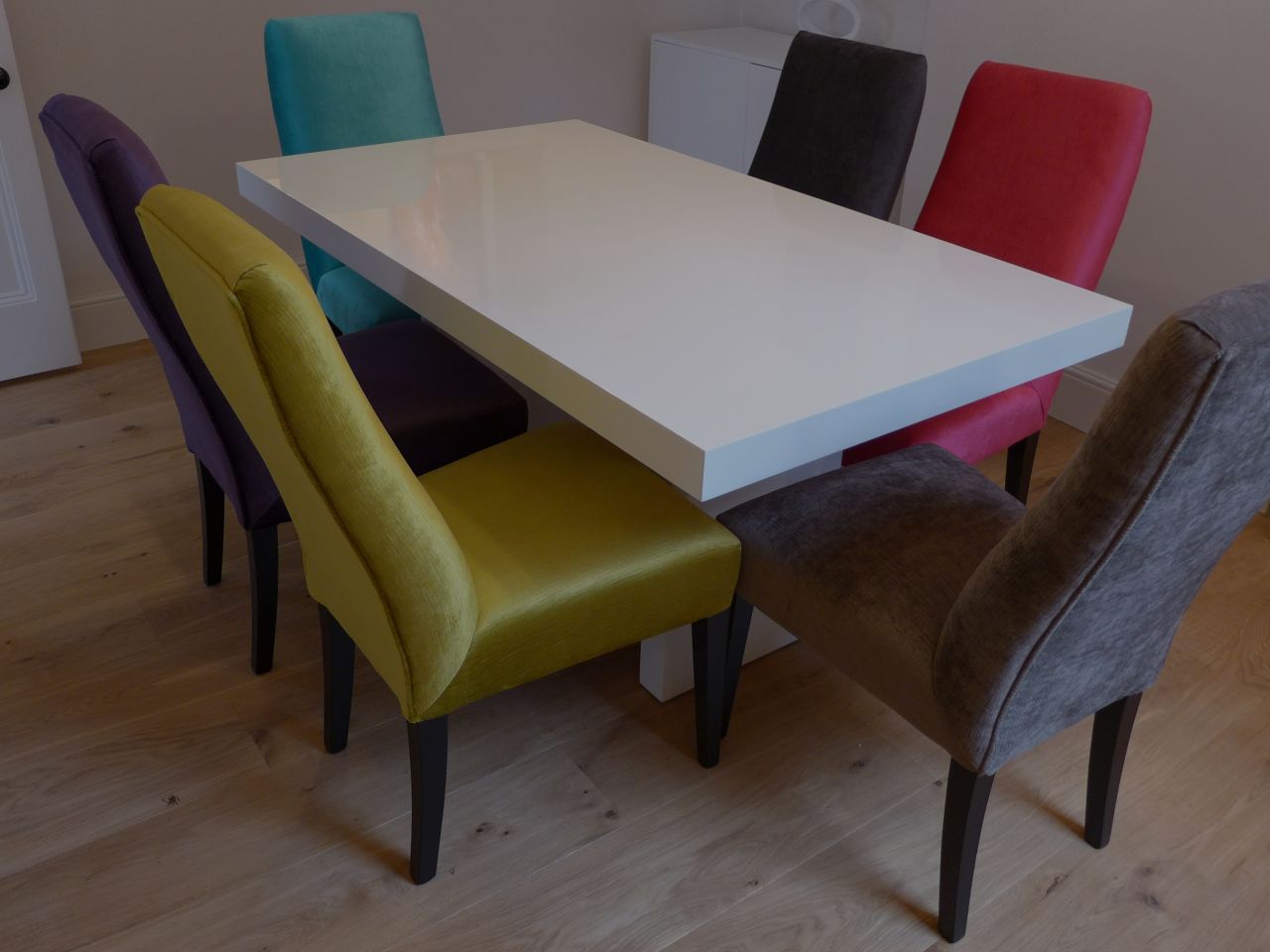 dining table with colourful chairs