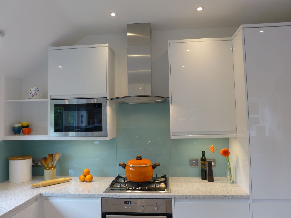 modern kitchen with ice blue glass splashback