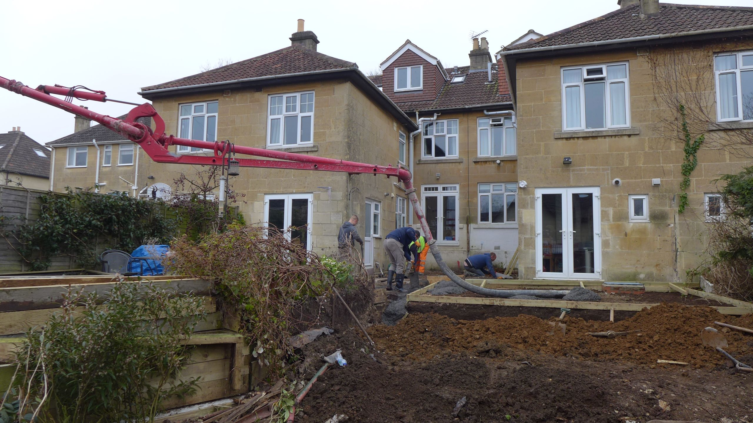 concrete pumped over fence