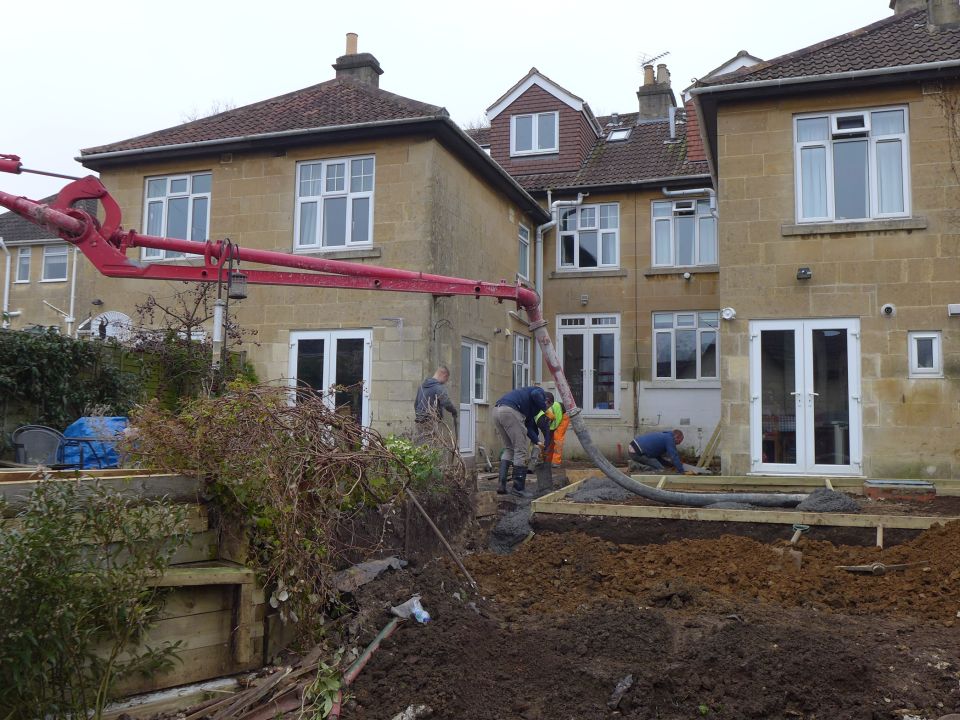 concrete pumped over fence