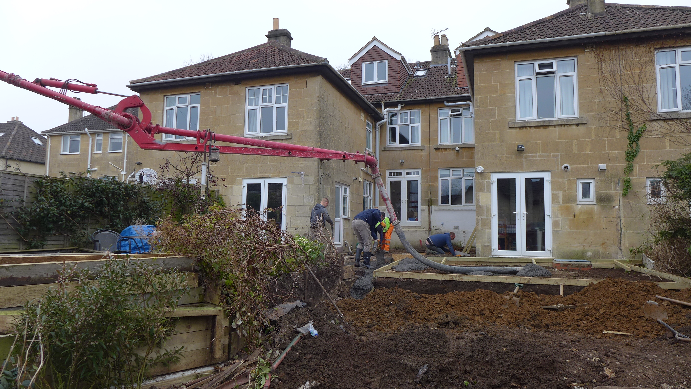 concrete pumped over fence