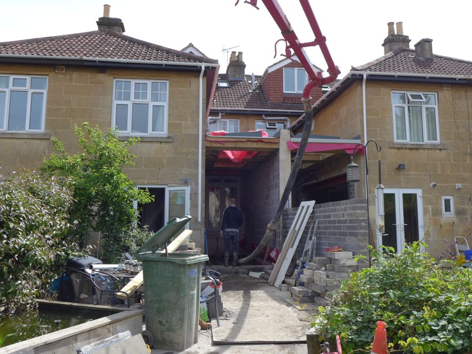 concrete pumped to create new floor slab