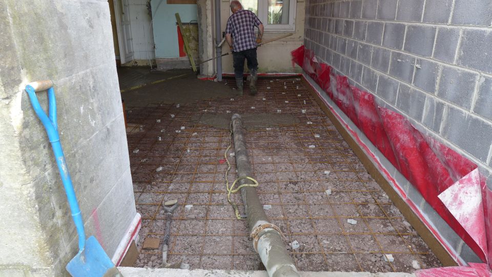 pumped concrete creates new floor slab