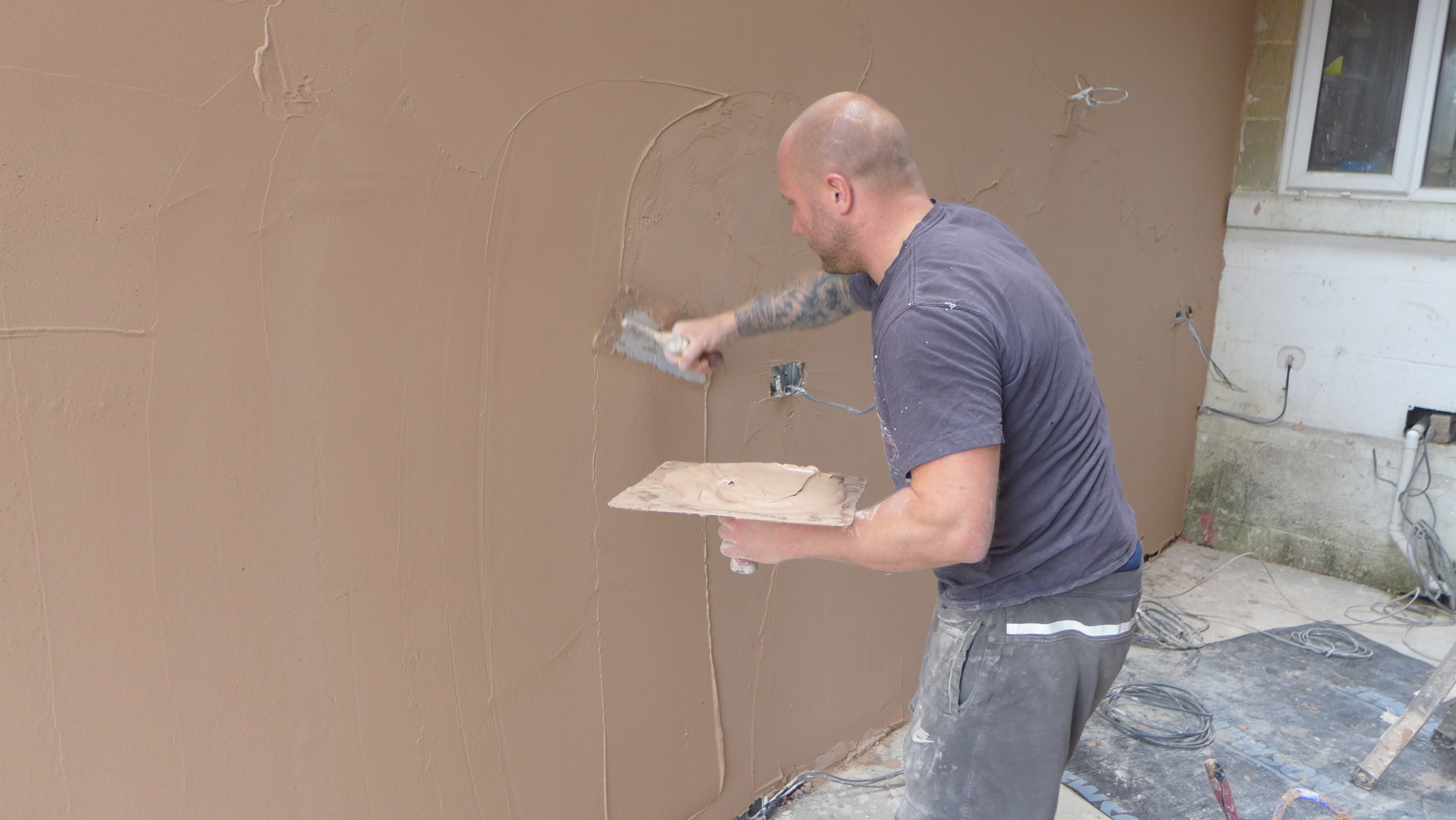 applying skim plaster coat