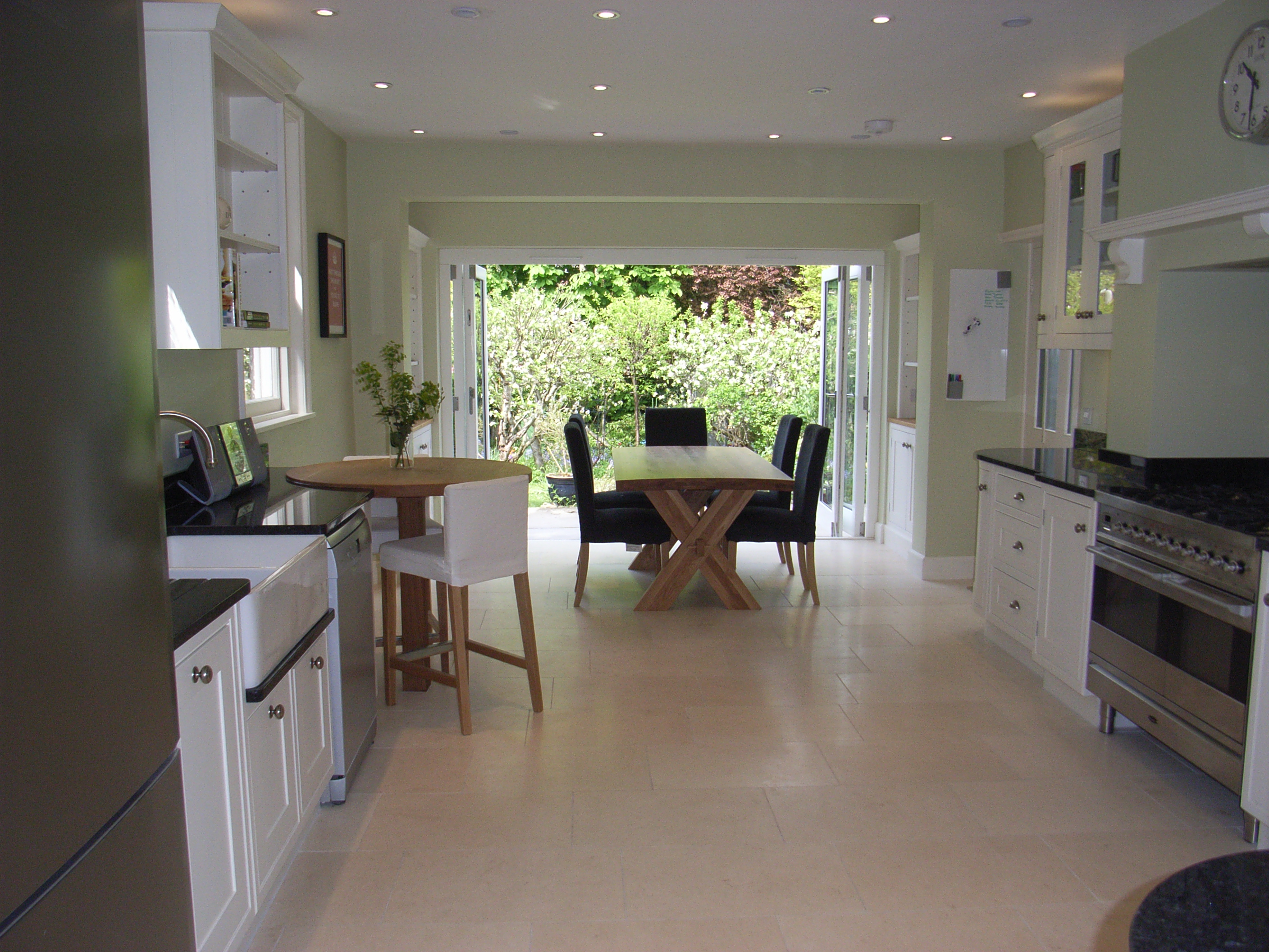a look at different types of kitchen floors, here a travertine tile leading to the garden room