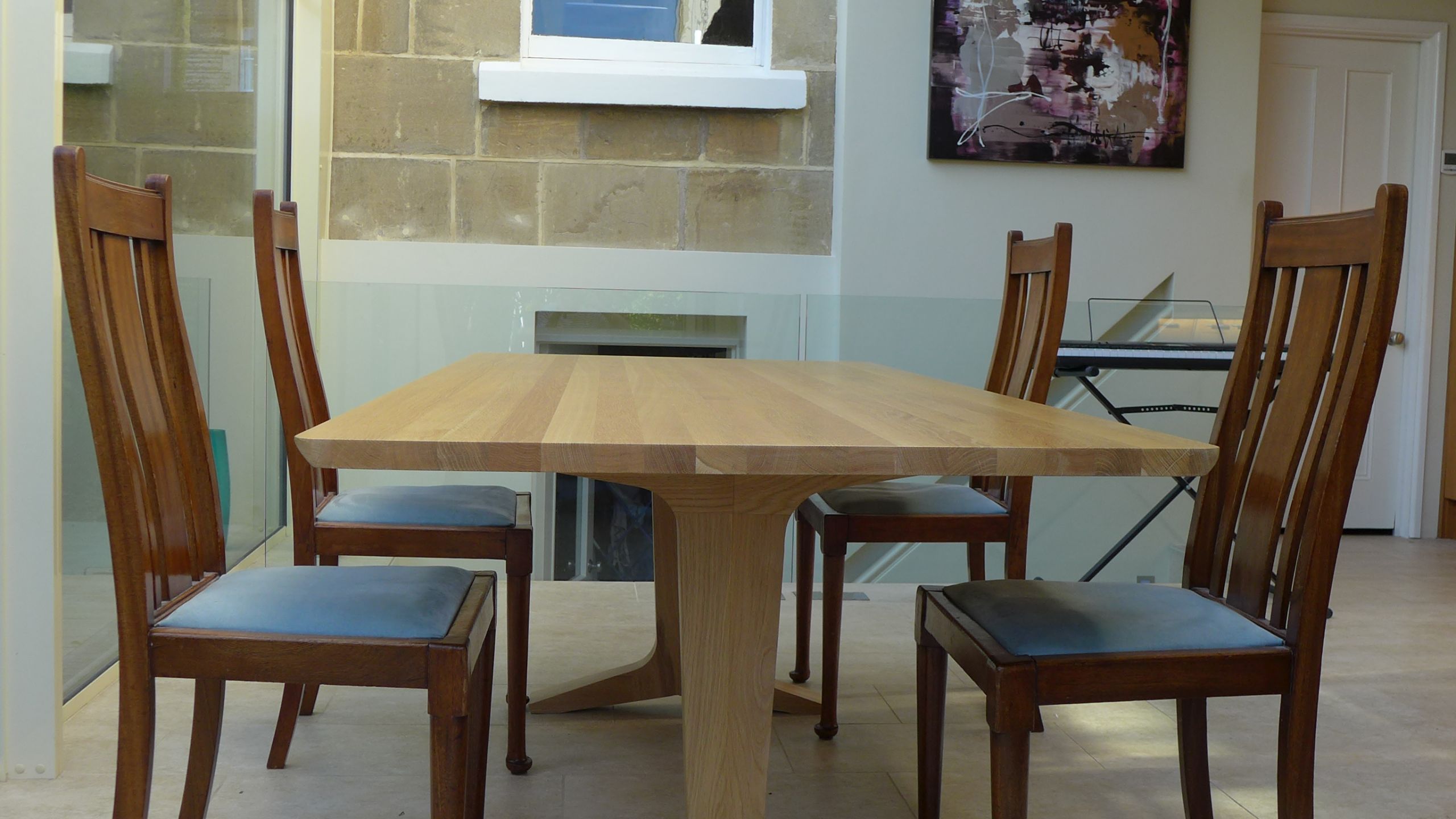 solid oak dining table in glass extension