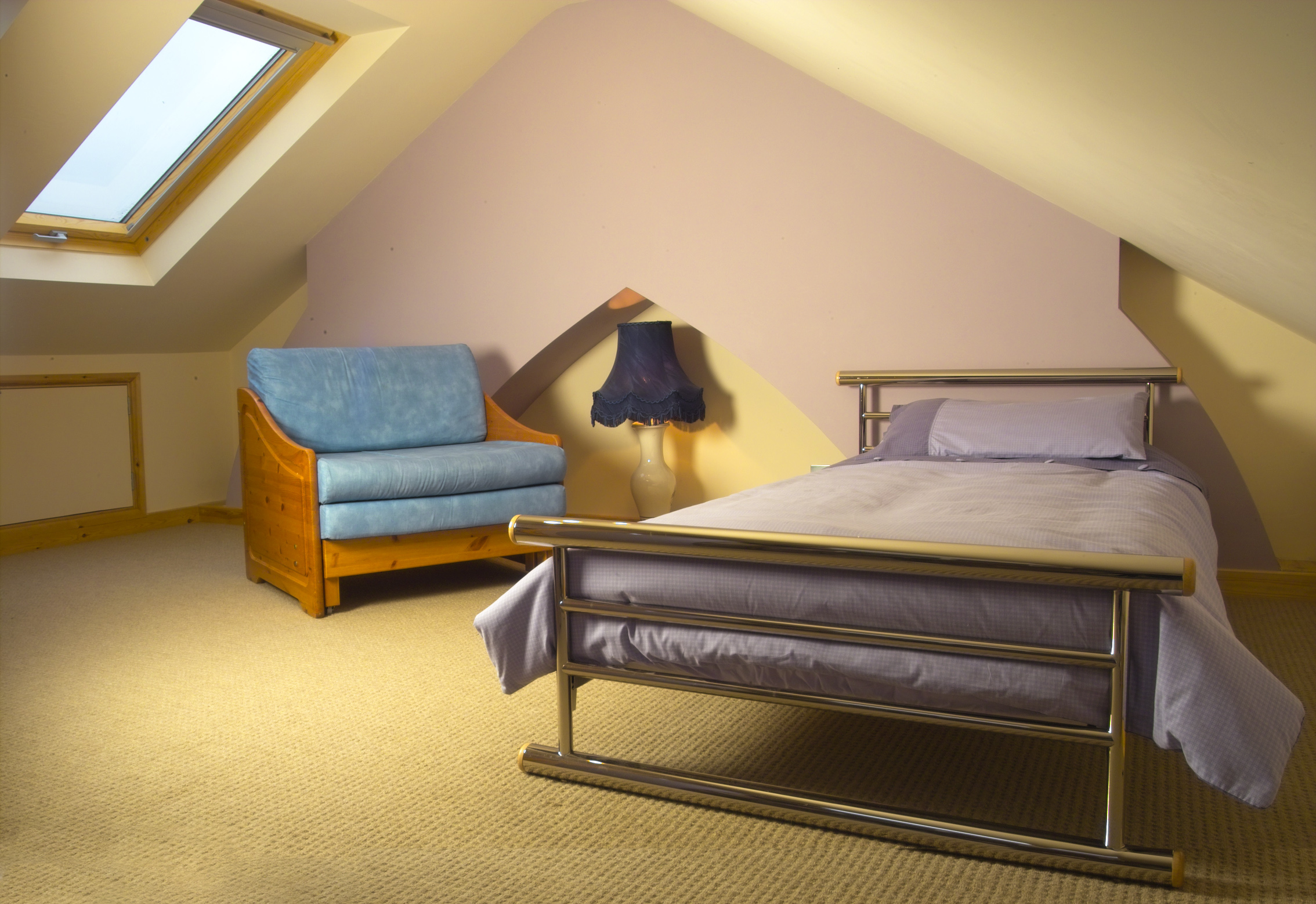 loft conversion - a bedroom with velux windows
