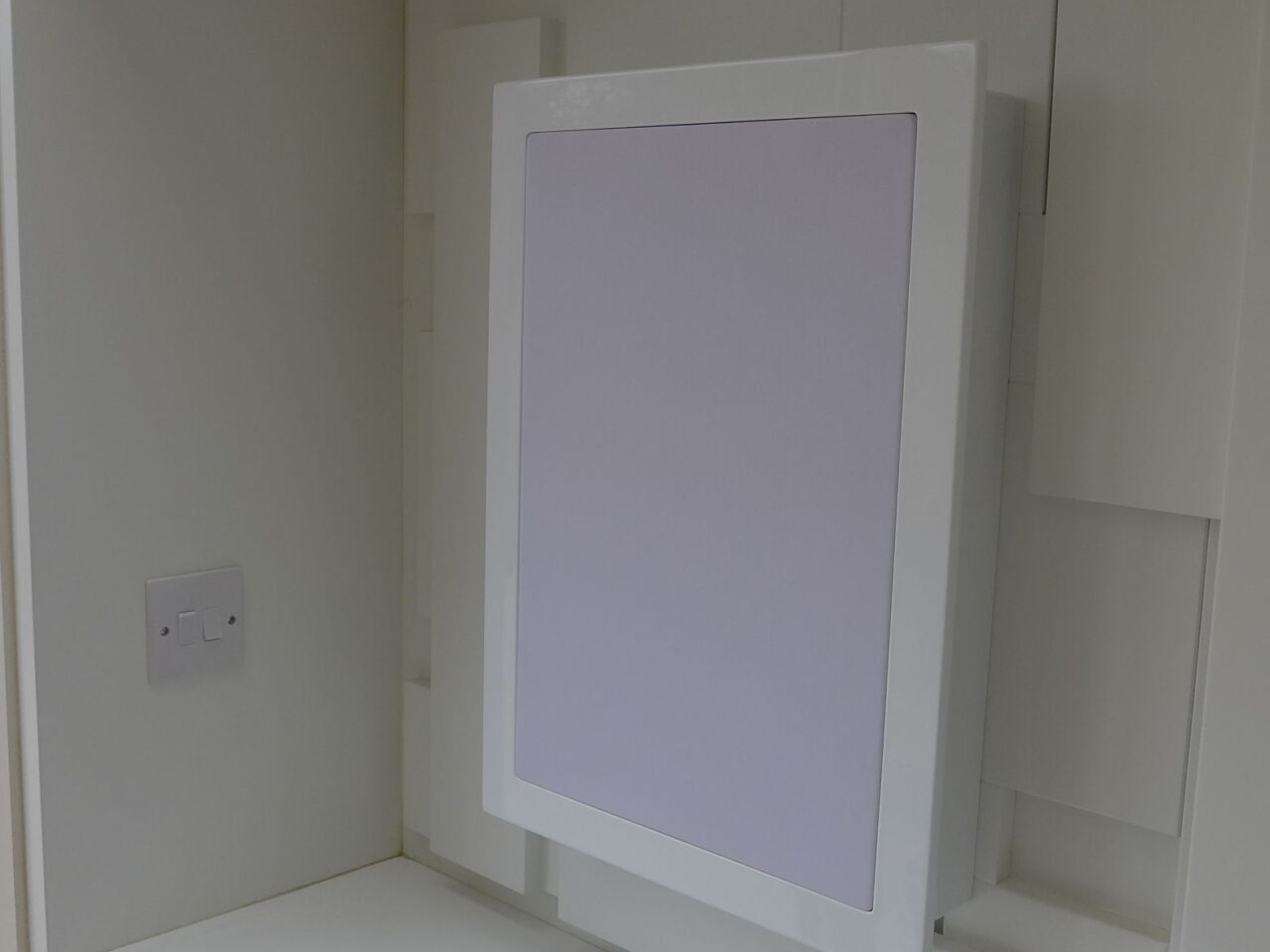 white speaker with cabinet