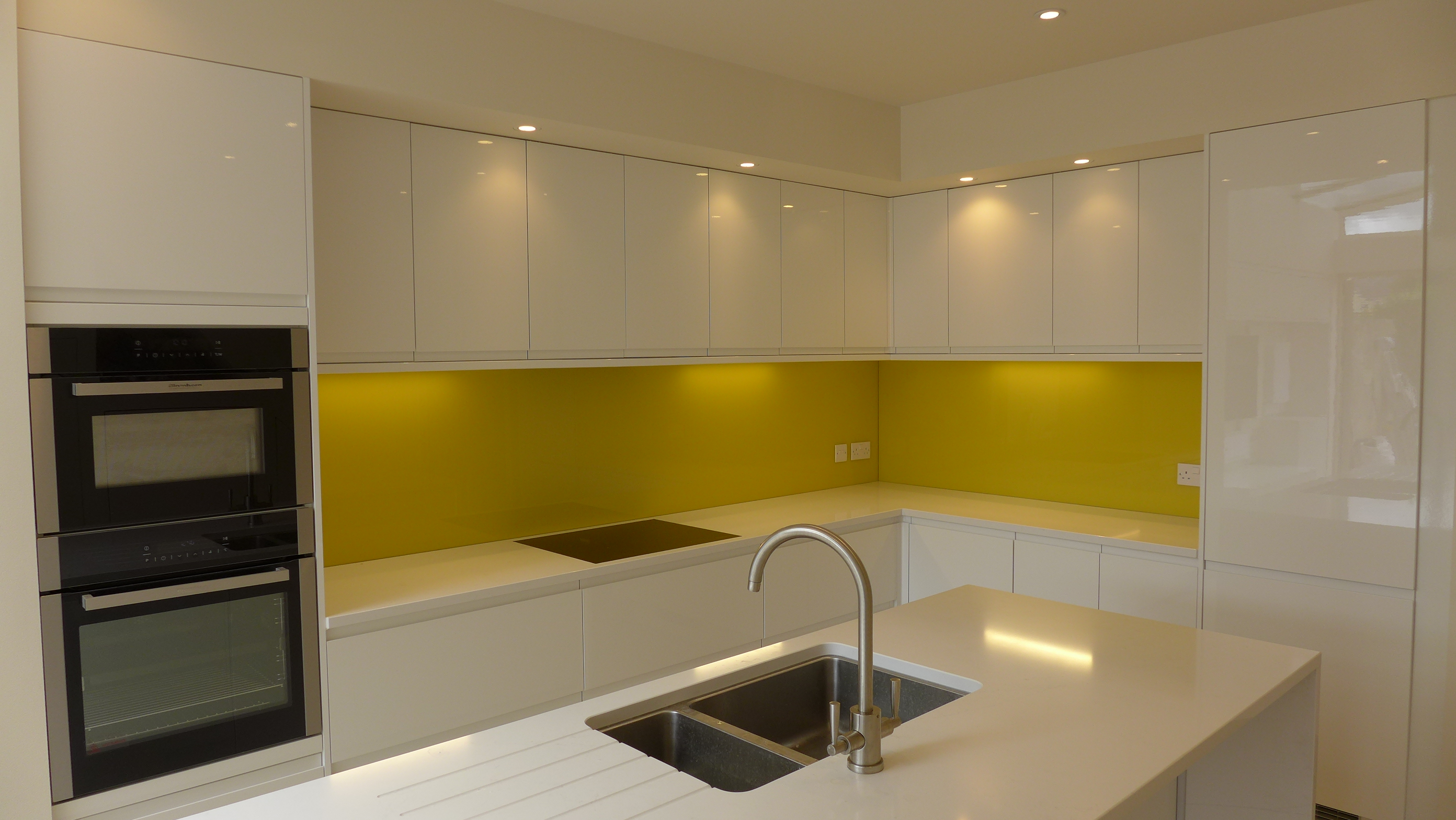 yellow glass kitchen splashback