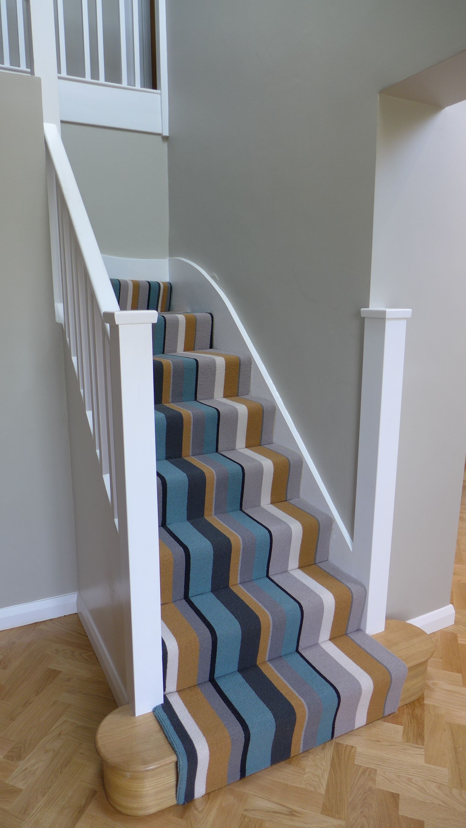 parquet floor to striped stair carpet